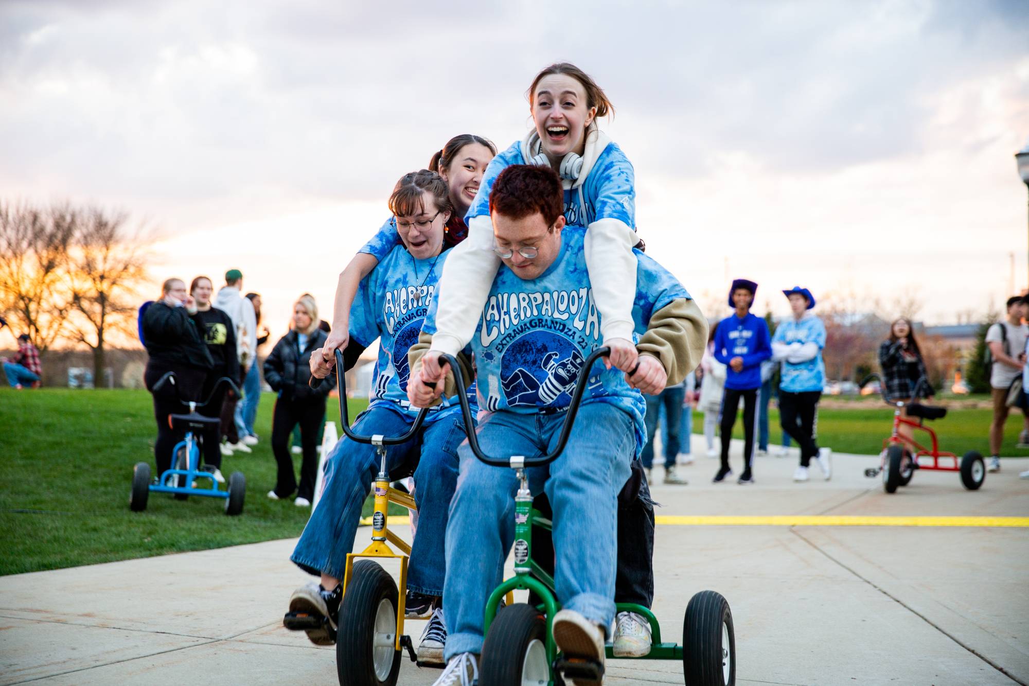 Students riding tricycles